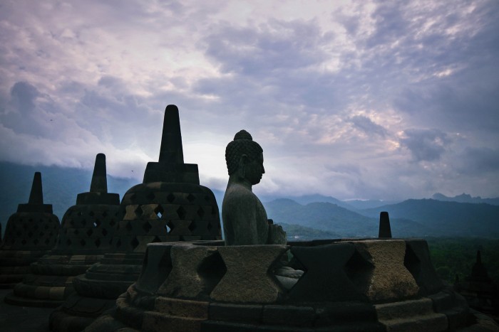 Misty morning unfolding around Candi Borobudur, Central Java This 9th century temple is surrounded by 4 volcanoes
