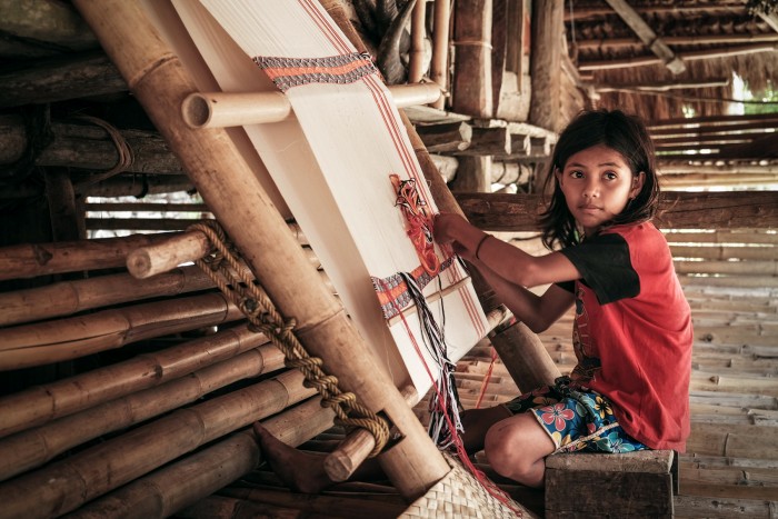 Taking baby steps towards self reliance, Indonesia Ela, 11years old indigenous girl, learnt weaving Ikkat from her mother and already mastered this art at her own home. Waingapu, Indonesia