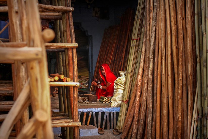The entrepreneur. Jodhpur Rajasthan A Rajasthani woman runs her own bamboo craft shop near Mehrangarh fort.